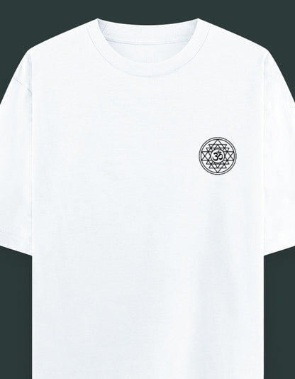 Off-white oversized spiritual t-shirt with embroidered Om Sri Yantra sacred geometry emblem on the left chest, worn by a male model.