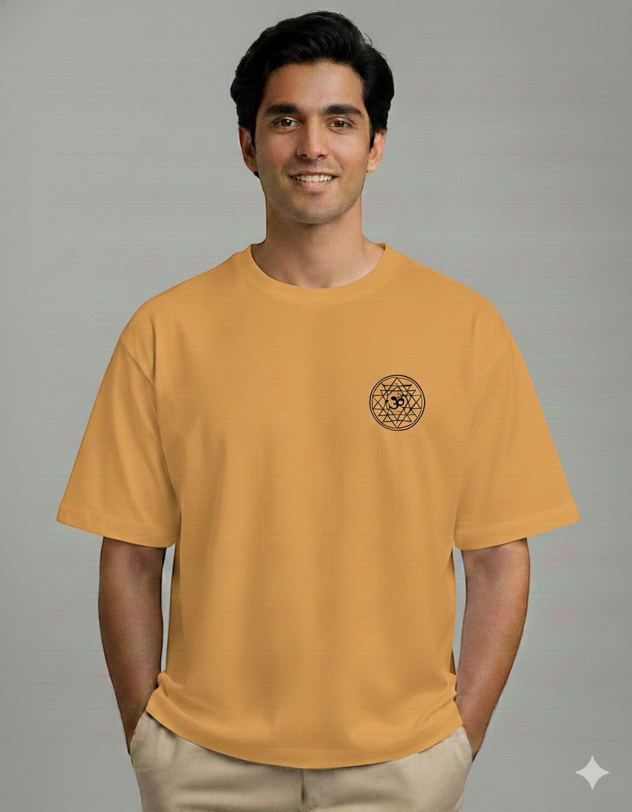 Off-white oversized spiritual t-shirt with embroidered Om Sri Yantra sacred geometry emblem on the left chest, worn by a male model.