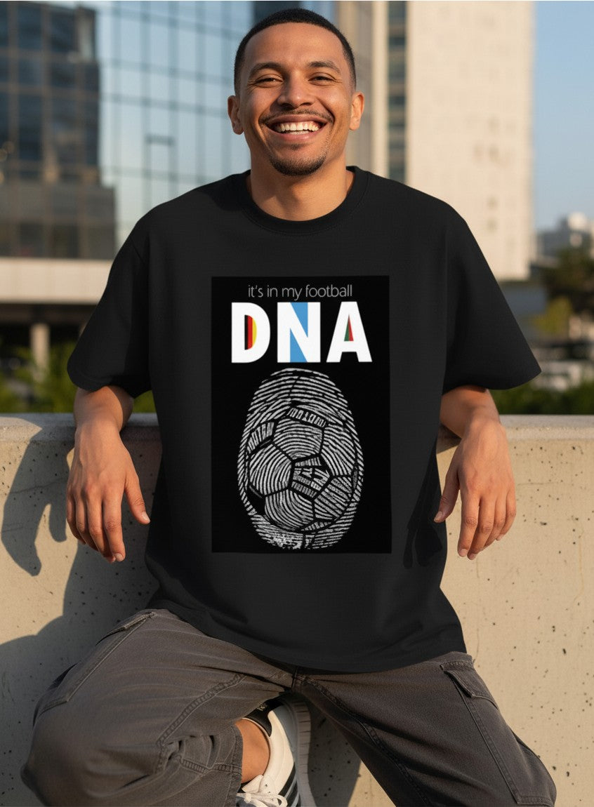 Print 999 black cotton crewneck t-shirt featuring a football DNA fingerprint graphic worn by a smiling man outdoors.