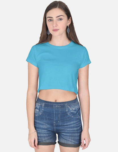 Print 999 light blue half-sleeve cotton crop top worn by a woman with dark hair against a plain background