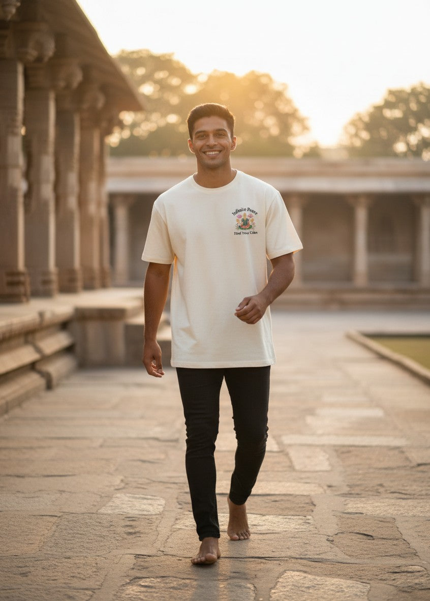 Print 999 cream heavyweight cotton oversized t-shirt with Peace is Power graphic worn by a man in a temple courtyard