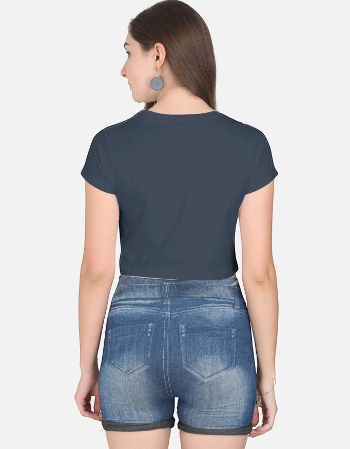 Back view of a woman wearing a Print 999 dark grey half-sleeve cotton crop top paired with denim shorts.