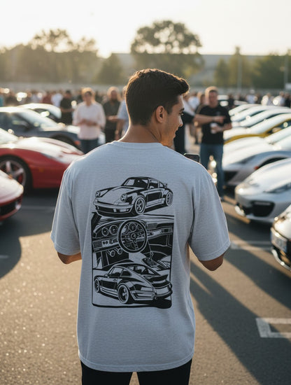 Print 999 grey oversized cotton t-shirt with sports car back graphic worn by a man at a car meet.