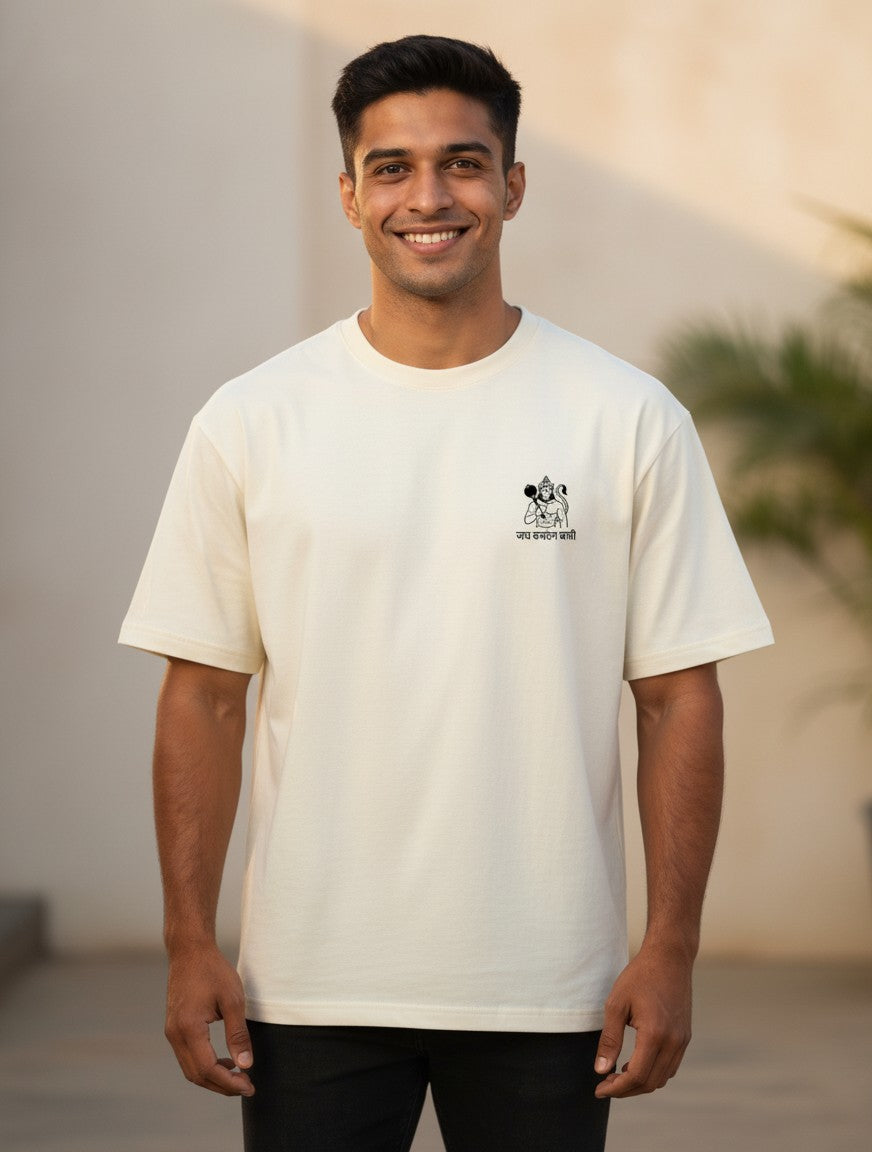 Print 999 off-white oversized t-shirt with a small Hanuman Ji emblem on the chest worn by a smiling man.