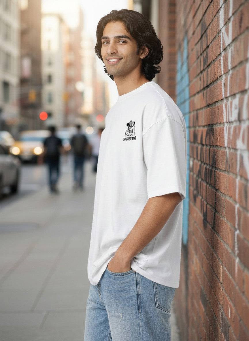 Print 999 white oversized t-shirt with Hanuman Ji chest embroidery worn by a man on a city street