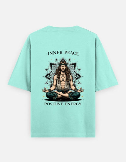 Print 999 mint green oversized cotton t-shirt featuring a back graphic of a meditating figure with mandala art.