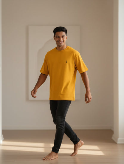 Print 999 mustard yellow oversized heavyweight cotton t-shirt with a minimal Shiva Trishul chest print on a man