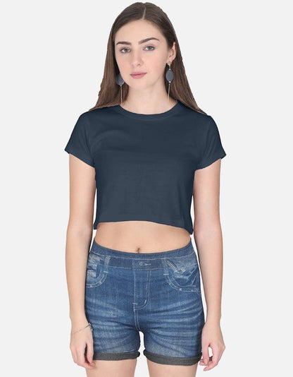Print 999 navy blue half-sleeve cotton crop top worn by a woman with denim shorts
