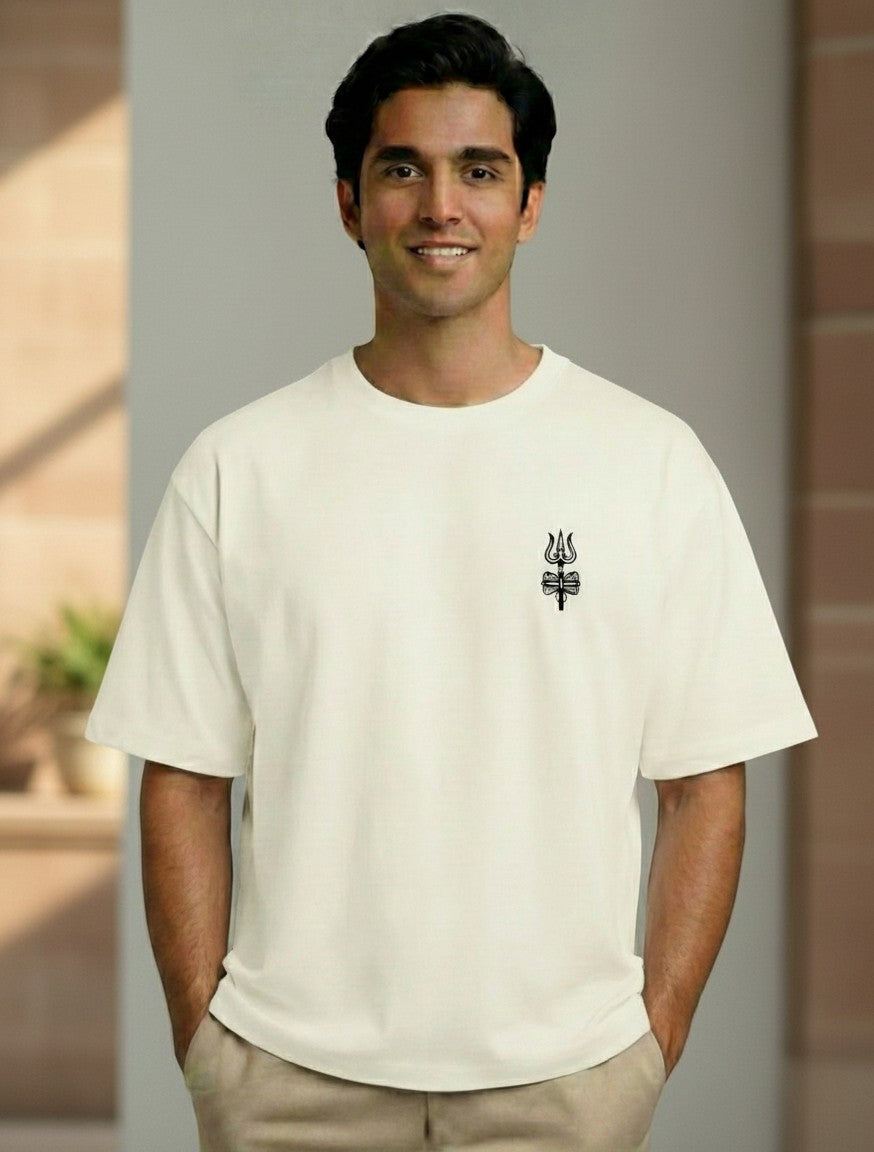 A man wearing a Print 999 off-white heavyweight cotton oversized t-shirt with a minimal black Shiva Trishul print.