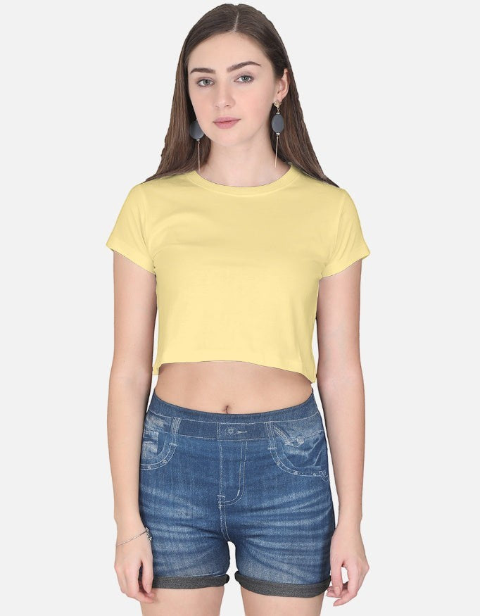 Print 999 yellow half-sleeve cotton crop top worn by a model with blue denim shorts